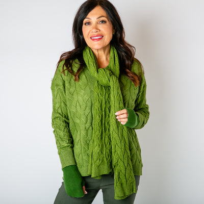 The leaf green Daphne Cable Knit Scarf which is super soft and perfect for chilly days