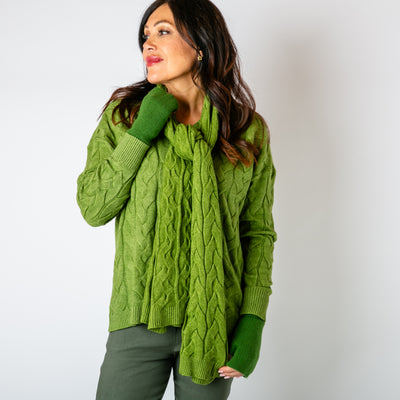 The leaf green Daphne Cable Knit Scarf made from a blend of viscose and nylon