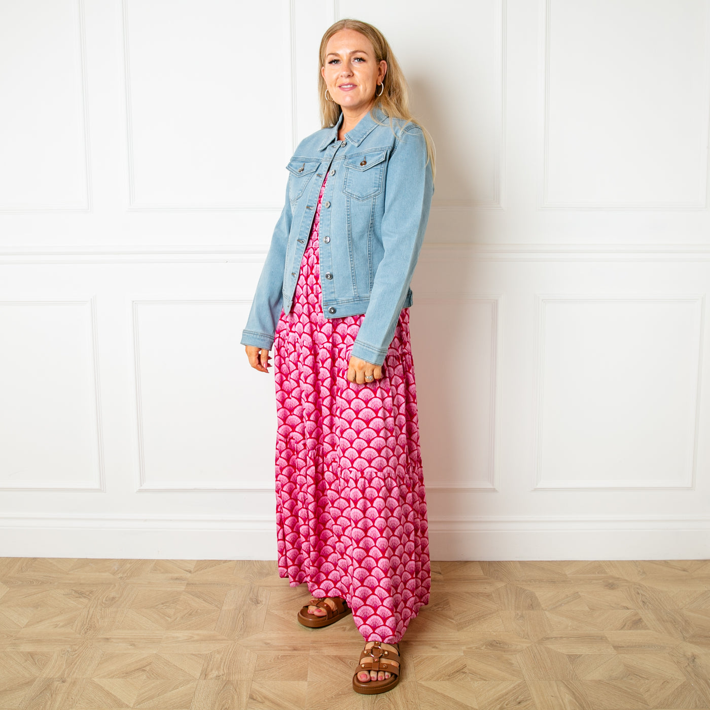 The mid-blue Denim Jacket with metal button fastenings down the front