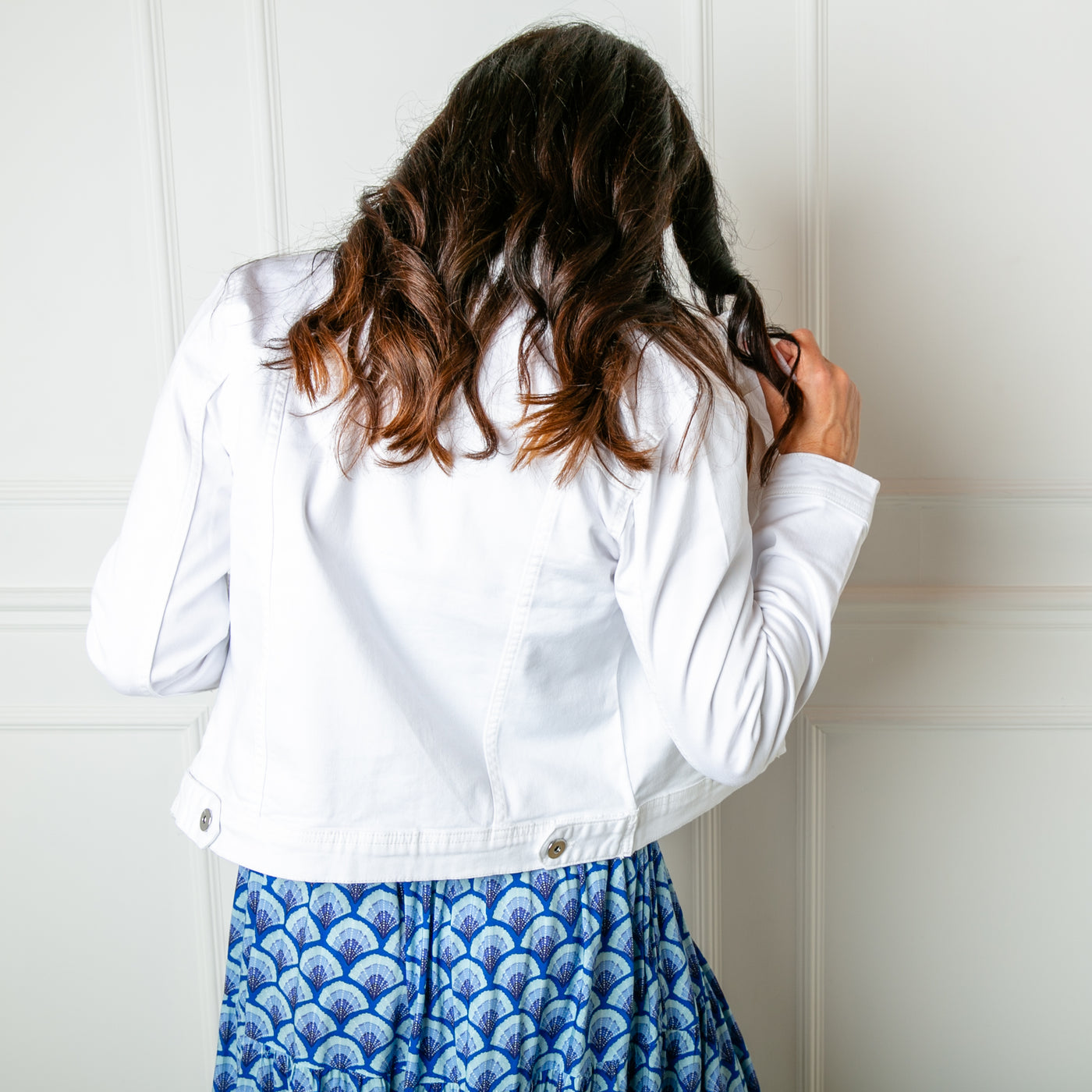 The white Denim Jacket with a traditional jacket collar for a more dressed up look