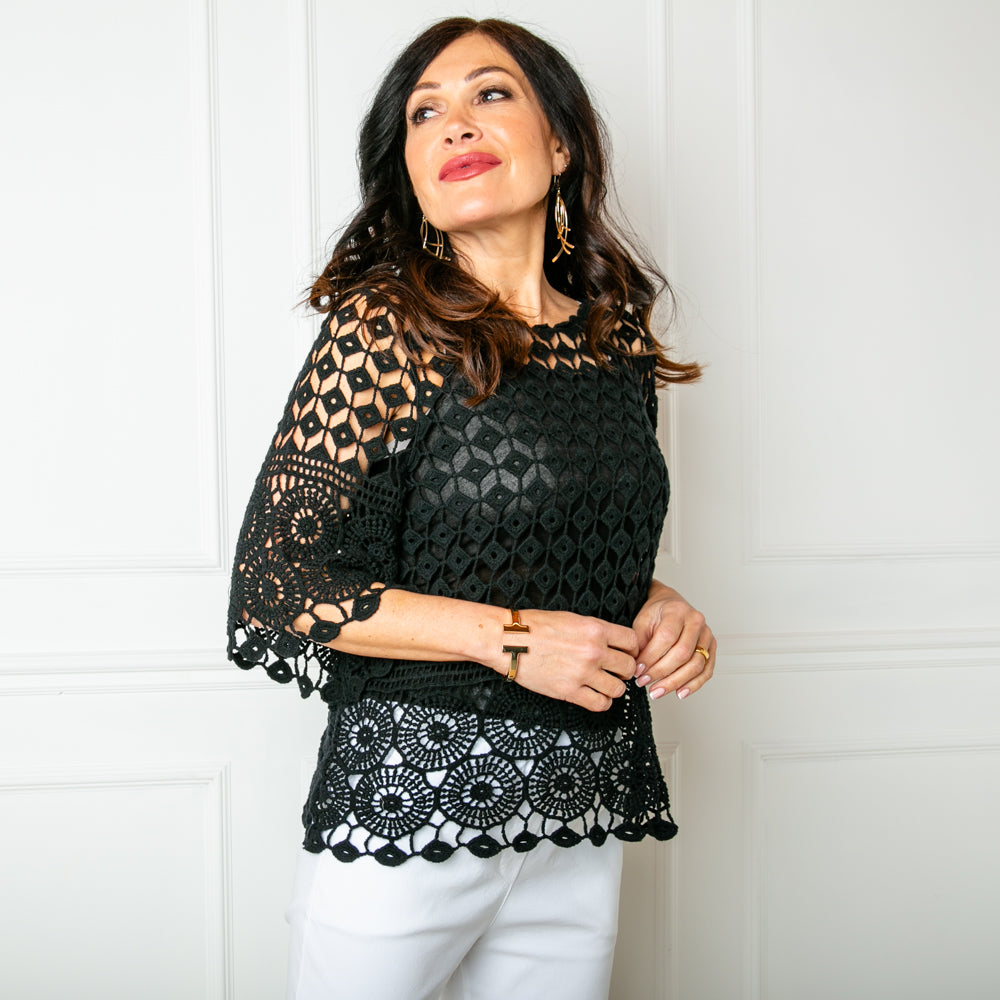 The black Diamond Crochet Top featuring a beautifully intricate crochet knitted pattern