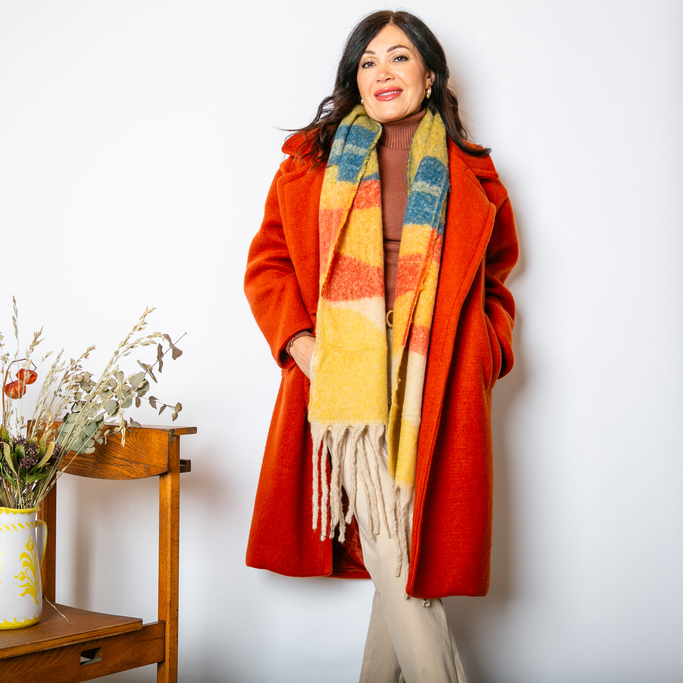 The Cinnamon Orange Double Faced Coat with pockets on either side of the hips