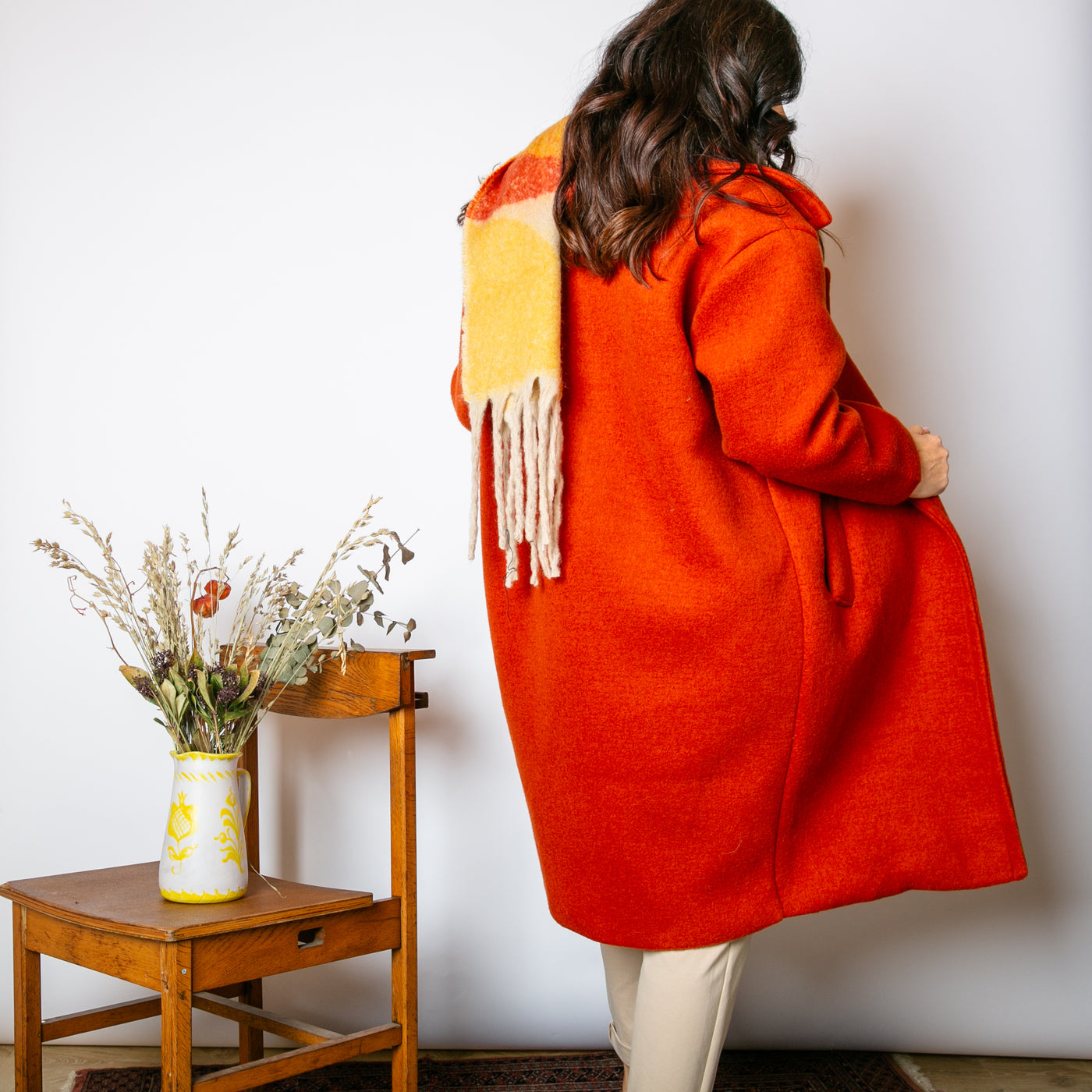 The cinnamon orange Double Faced Coat with long sleeves and a longline silhouette