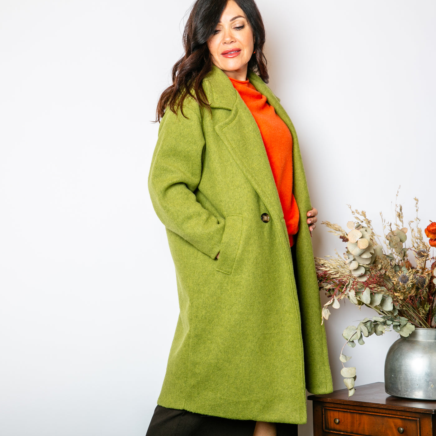 The pistachio green Double Faced Coat with long sleeves and a longline silhouette