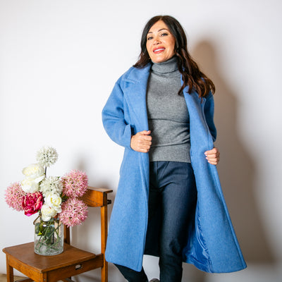 The powder blue Double Faced Coat with pockets on either side of the hips