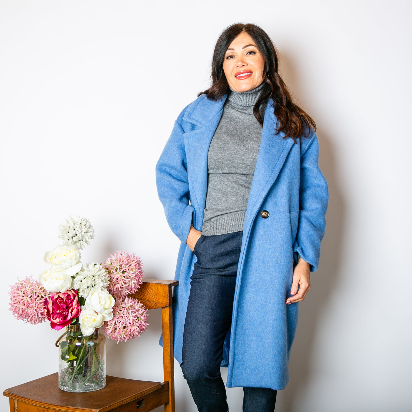 The powder blue Double Faced Coat with long sleeves and a longline silhouette