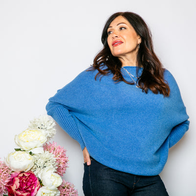 The Drop Sleeve Jumper in denim blue with a round slash neckline