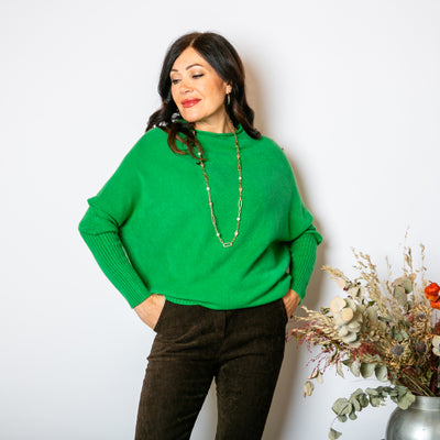 The Drop Sleeve Jumper in emerald green with a round slash neckline