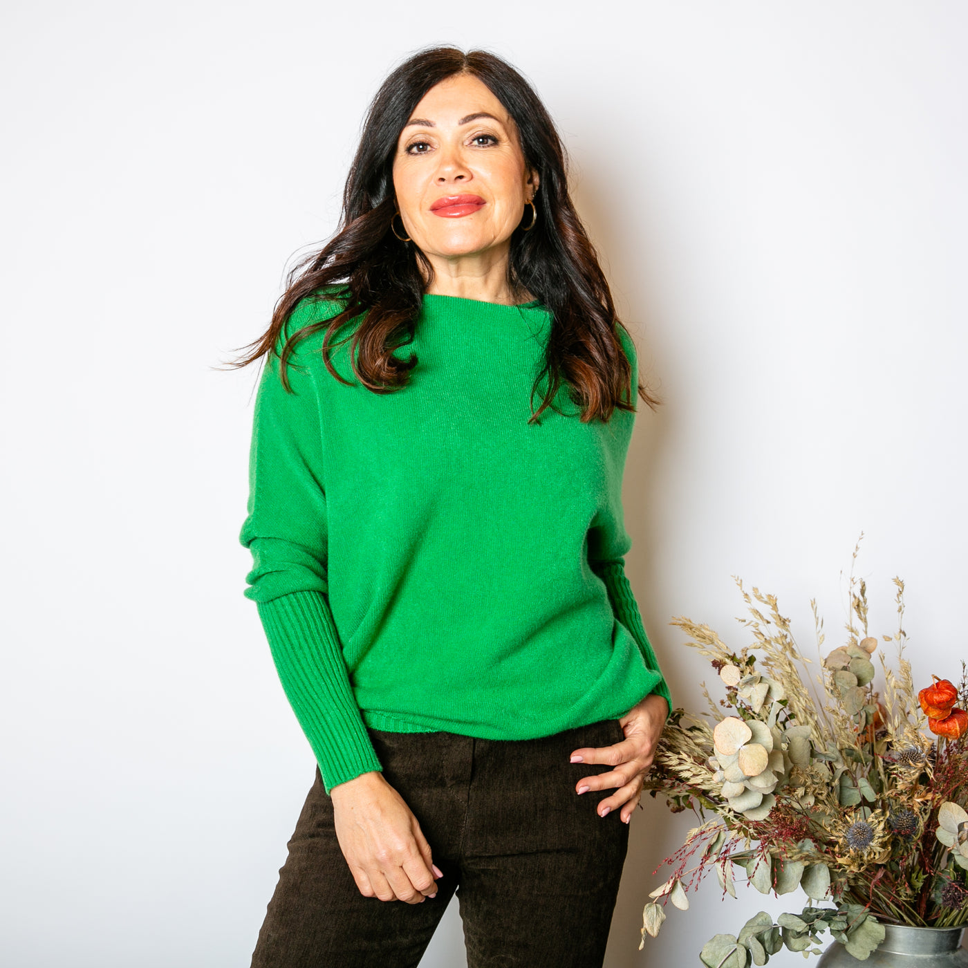 The Drop Sleeve Jumper in emerald green made from a super soft stretchy material perfect for winter