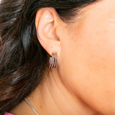 The silver Ennis Earrings made up of five delicate hoops joined at either end