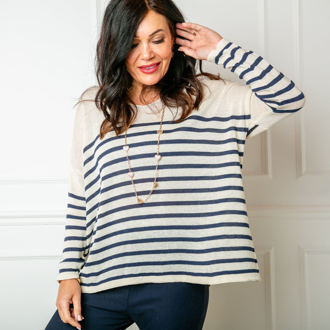 The Fine Knit Stripe Jumper in cream with navy blue stripes across the sleeves and body