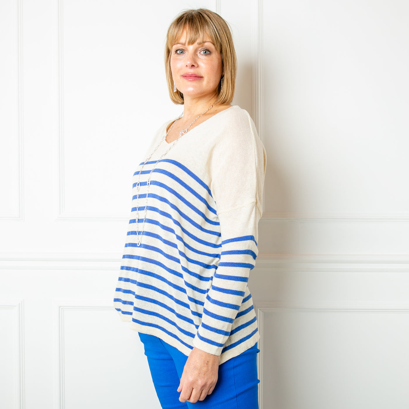 The Fine Knit Stripe Jumper in cream with royal blue stripes across the sleeves and body