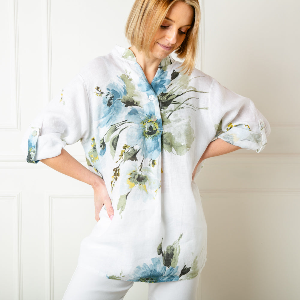 The white Floral Linen Top with 3/4 length sleeves that can be buttoned and fastened at the elbow