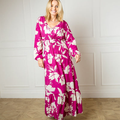 The fuchsia pink Floral Print Maxi Dress with a v neckline and long sleeves elasticated at the cuff