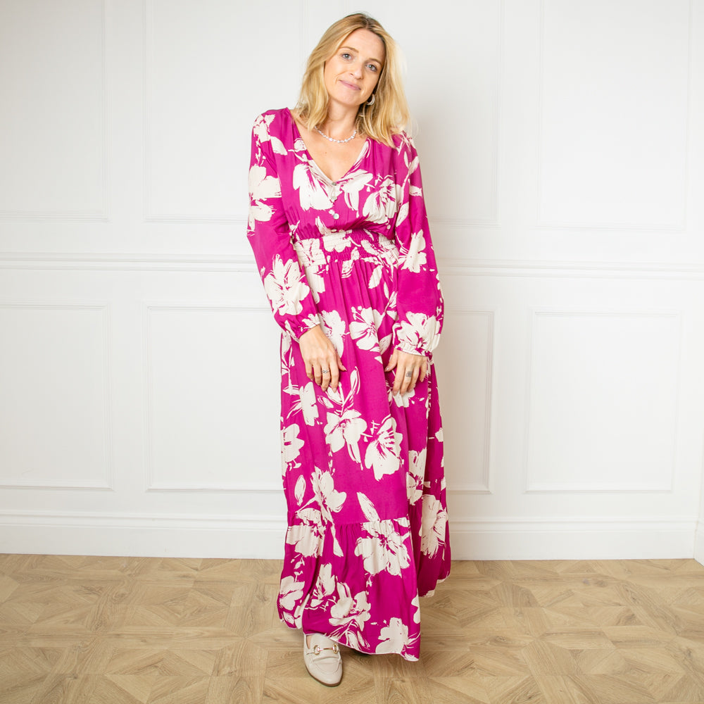 The fuchsia pink Floral Print Maxi Dress featuring a colourful flower pattern perfect for brightening up a winter wardrobe