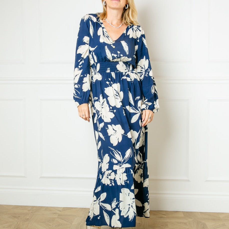 The navy blue Floral Print Maxi Dress with a v neckline and long sleeves elasticated at the cuff