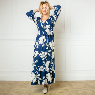 The navy blue Floral Print Maxi Dress featuring a colourful flower pattern perfect for brightening up a winter wardrobe