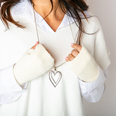 The cream Freya Fingerless Gloves made from a soft, stretchy, ribbed material