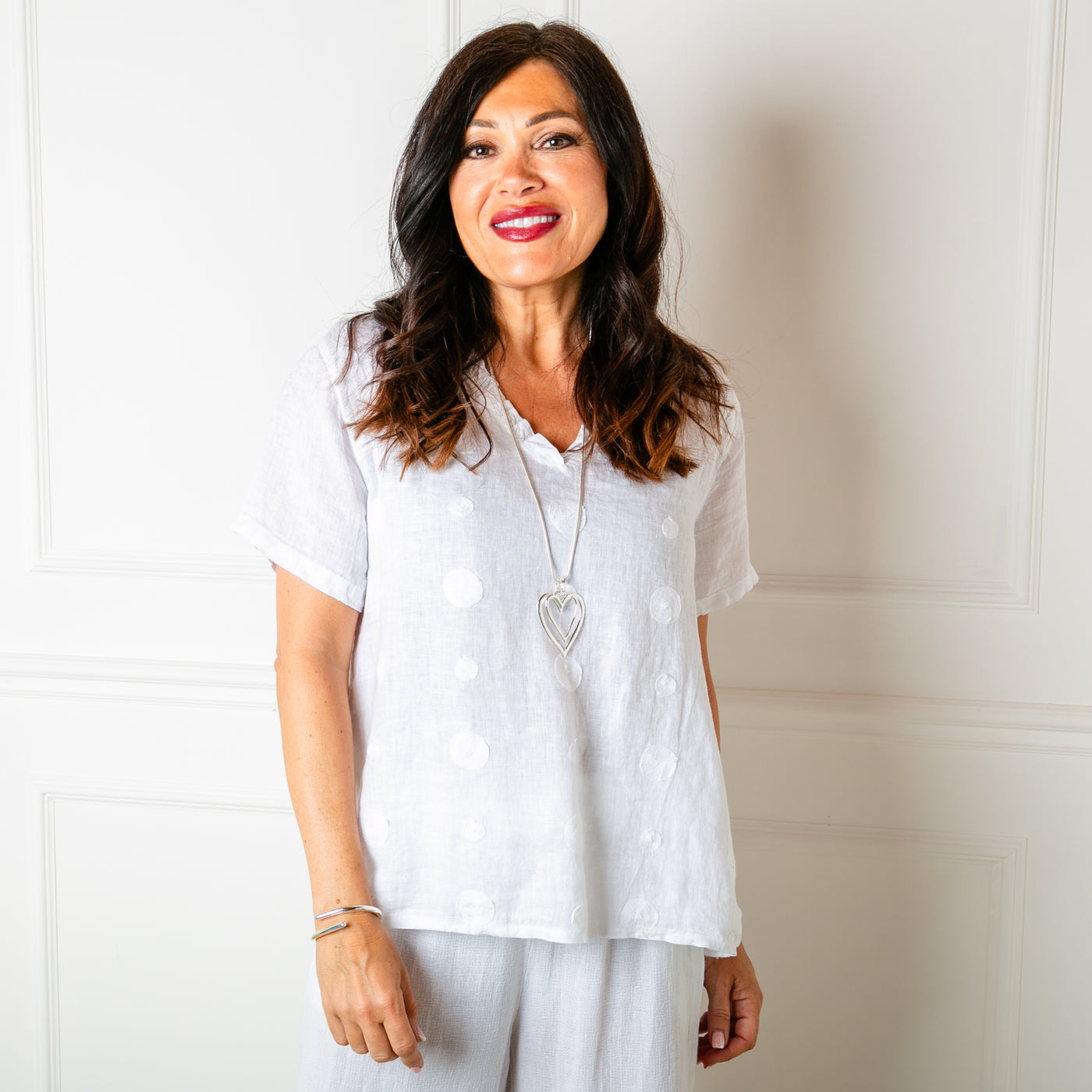 The white Frill Neck Linen Top with a short gathered ruffle finish around the neckline