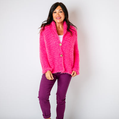 The fuchsia pink Fuzzy Collar Cardigan with long sleeves with a dropped seam