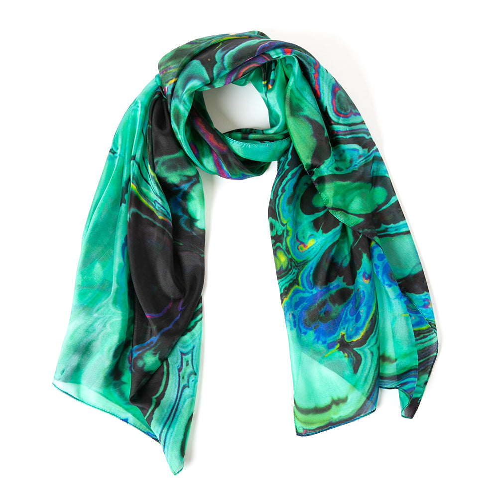 the green oil silk scarf pictured in a loose knot