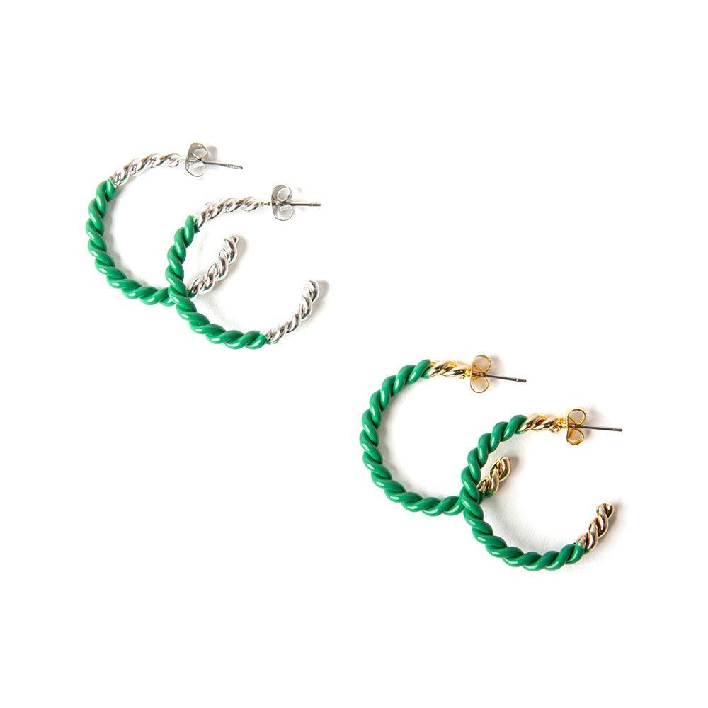 The Hannah Earrings in emerald green with silver and gold. Featuring a twist detail these hoops are a statement piece.