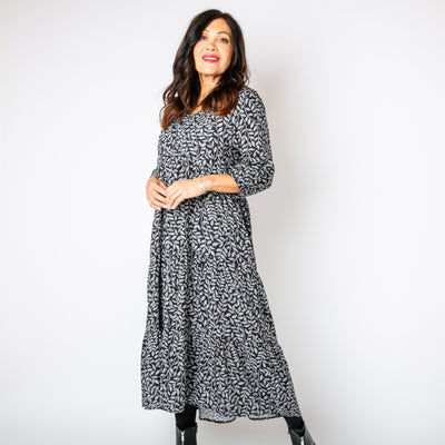 The charcoal grey Hazel Patterned 3/4 Sleeve Dress with a tiered skirt in a maxi length 