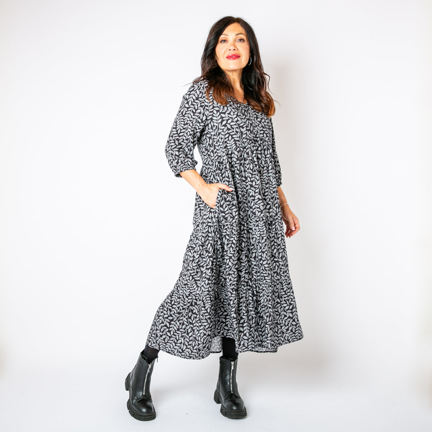 The charcoal grey Hazel Patterned 3/4 Sleeve Dress with a v neckline and pockets on either side of the hip