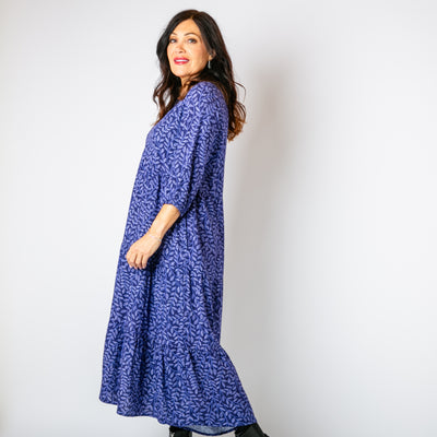 The navy blue Hazel Patterned 3/4 Sleeve Dress with a v neckline and pockets on either side of the hip