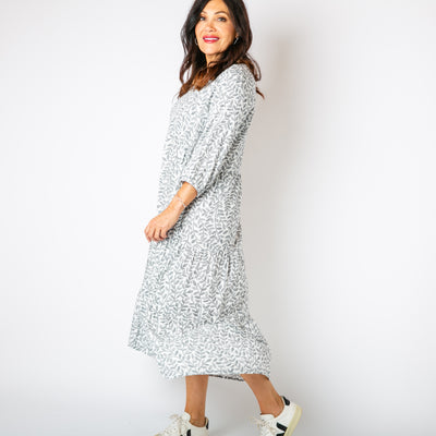 The white Hazel Patterned 3/4 Sleeve Dress with stretchy elastic on the cuffs