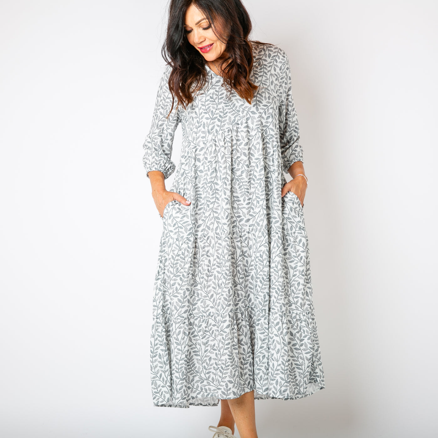 The white Hazel Patterned 3/4 Sleeve Dress with a tiered skirt in a maxi length 