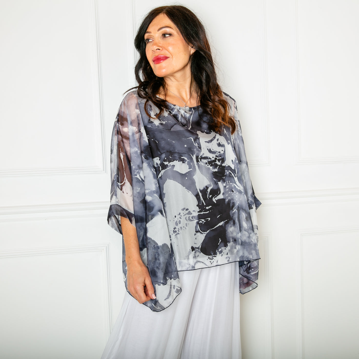 The charcoal grey Ink Blot Blouse with a round neckline and big dropped sleeves