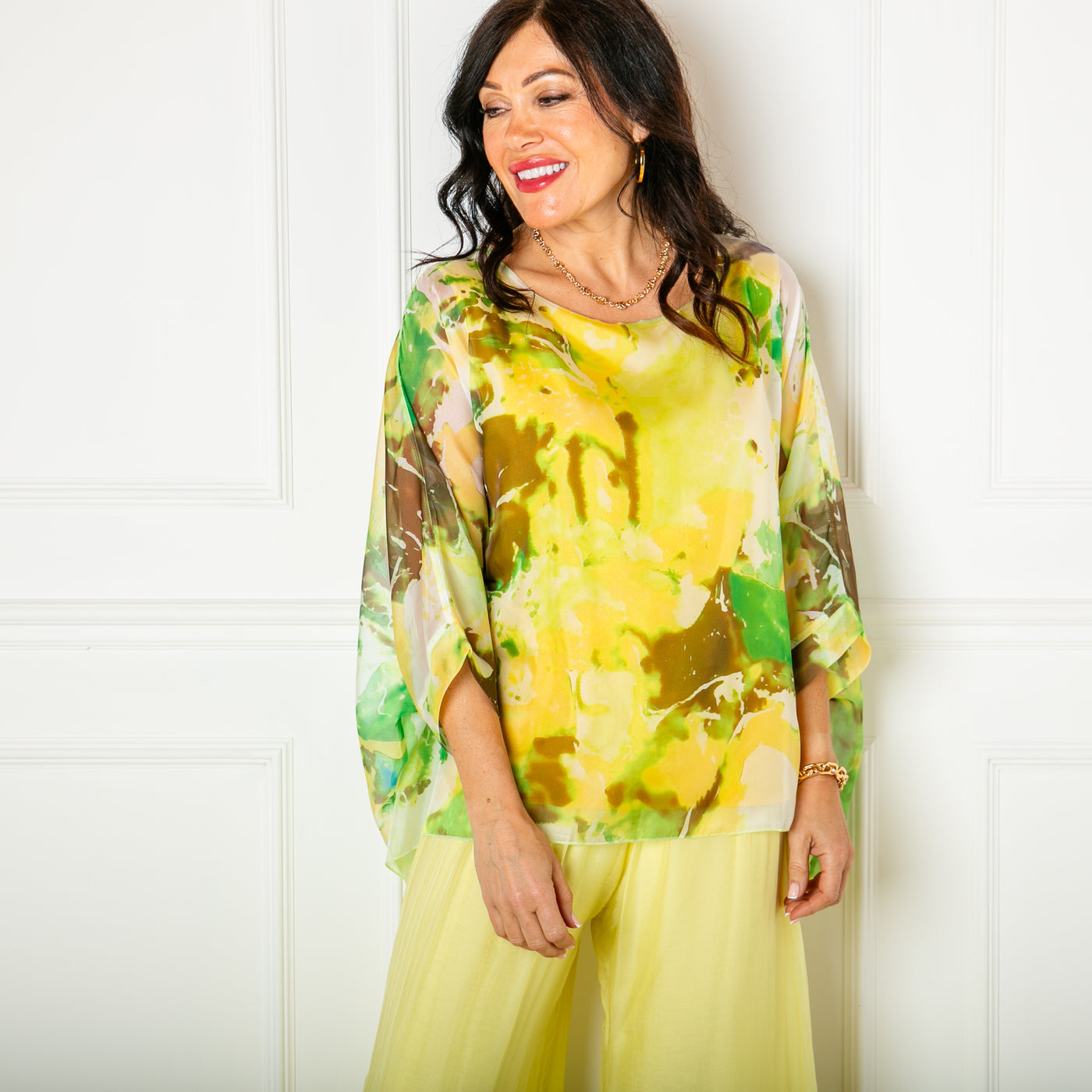 The yellow Ink Blot Blouse with a round neckline and big dropped sleeves