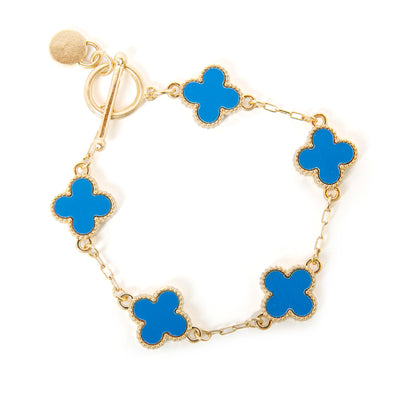 The blue Ivy Bracelet featuring four leaf clover shaped pendants on a wide link chain