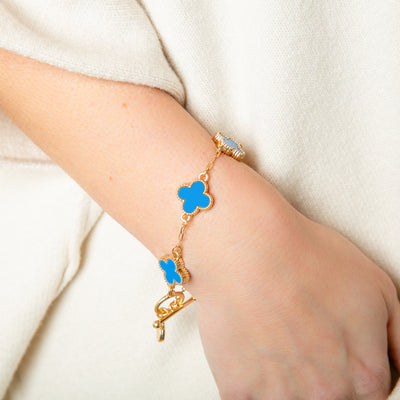 The blue Ivy Bracelet with a T bar toggle fastening, perfect for adding a pop of colour to any outfit 