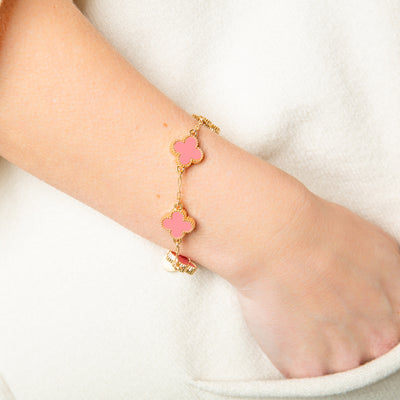 The pink Ivy Bracelet with a T bar toggle fastening, perfect for adding a pop of colour to any outfit