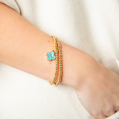 The sky blue Ivy Charm Bracelet featuring a gorgeous coloured charm in a four leaf clover shape