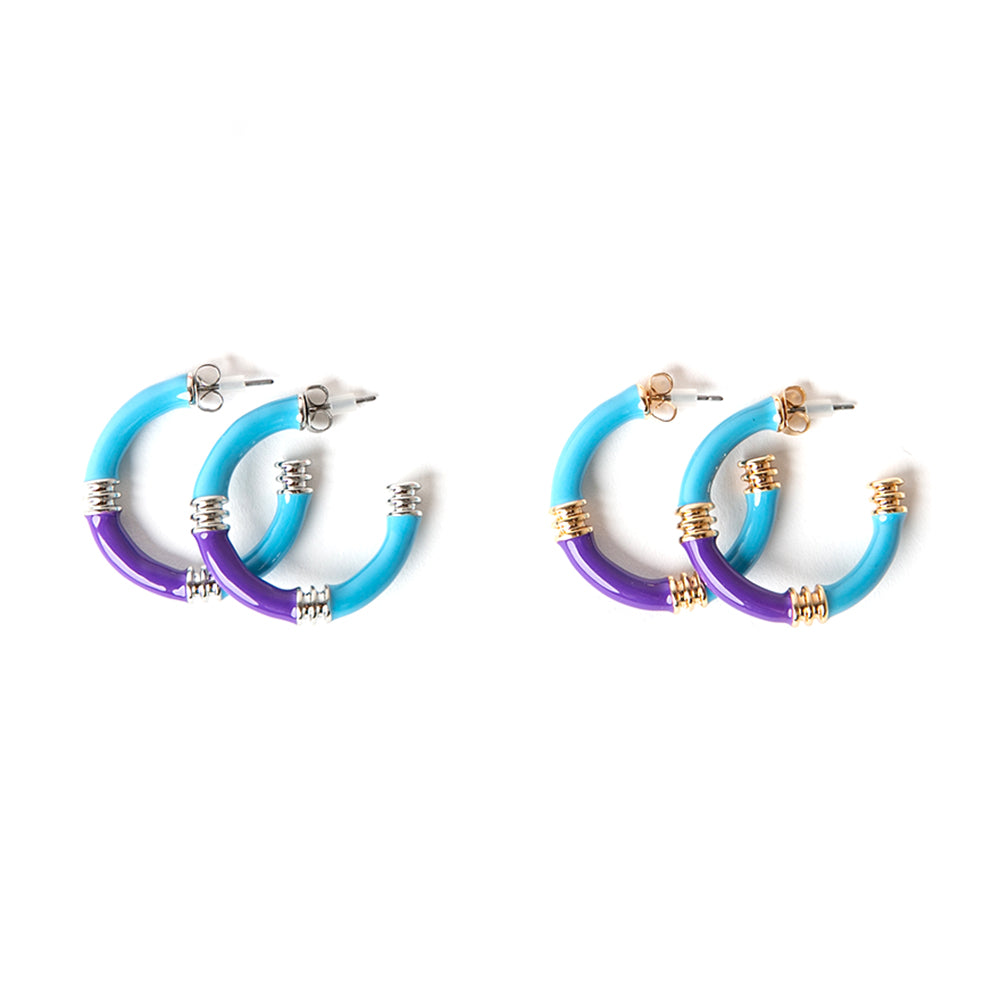 The Jace Hoop Earrings available in silver and gold plating with hints of blue and purple