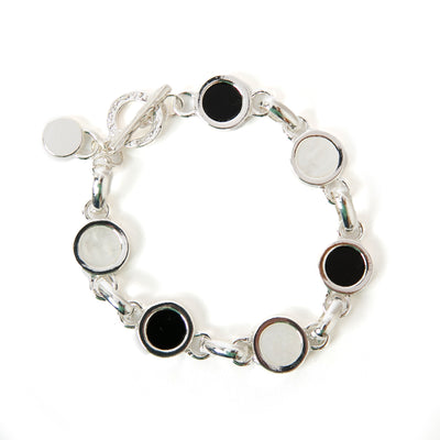 Jasmine Bracelet in silver with a chain link design and black and white disc pendants