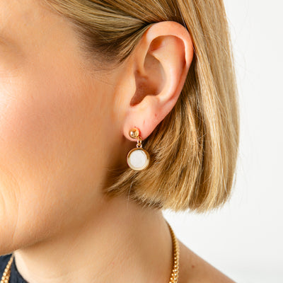 The gold and white Jasmine Earrings with a stud back fastening to keep them secure