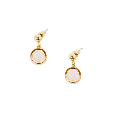 The Jasmine earrings in gold with a white circular pendant in the middle in a droplet shape 