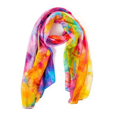 The Kaleidoscope Silk Scarf featuring a beautiful array of pink purple blue red orange and yellow tones