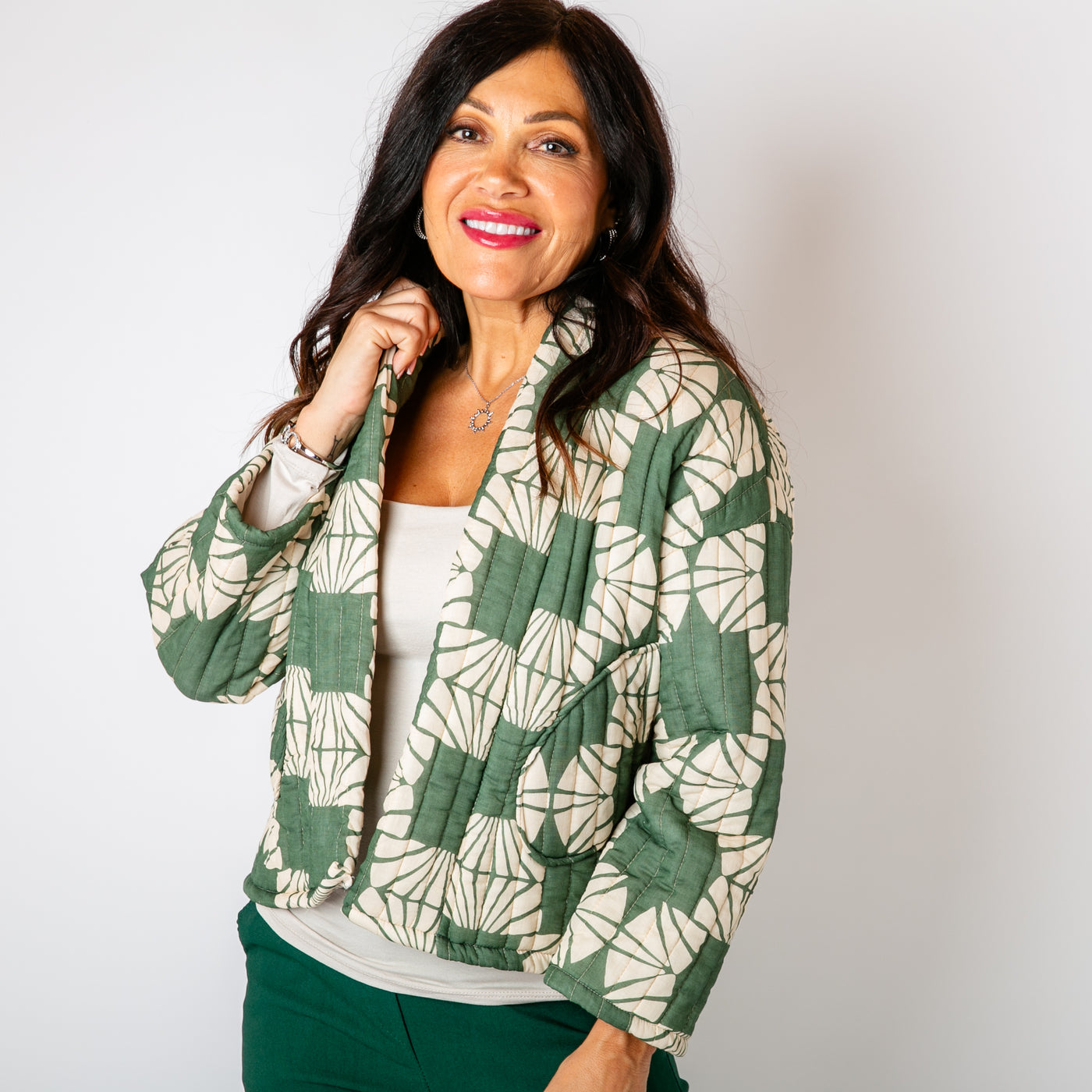 The forest green Kimono Pattern Quilted Jacket with long sleeves and an open front