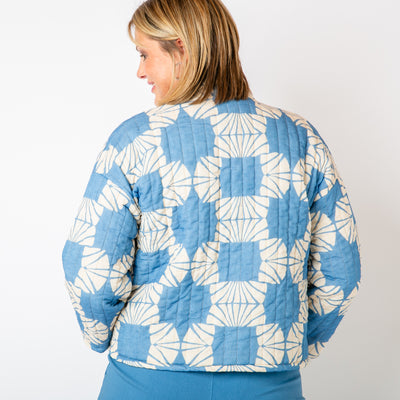 The french blue Kimono Pattern Quilted Jacket with pockets on either side of the hips