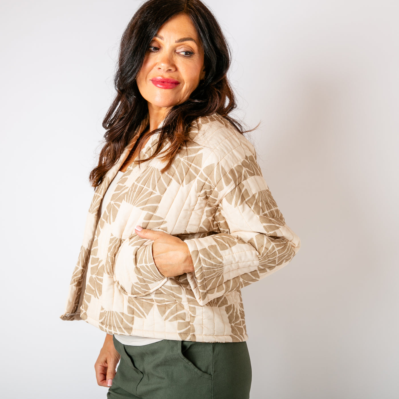 The stone cream Kimono Pattern Quilted Jacket with pockets on either side of the hips