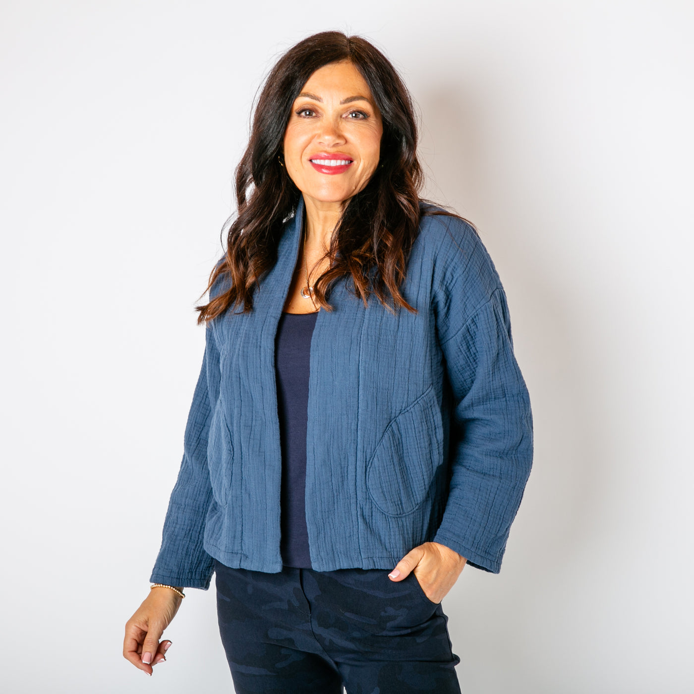 The denim blue Kimono Quilted Jacket with long sleeves and an open front