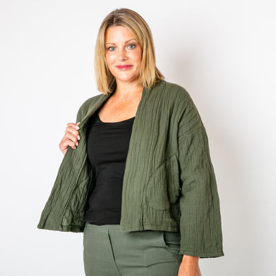 The khaki green Kimono Quilted Jacket with long sleeves and an open front