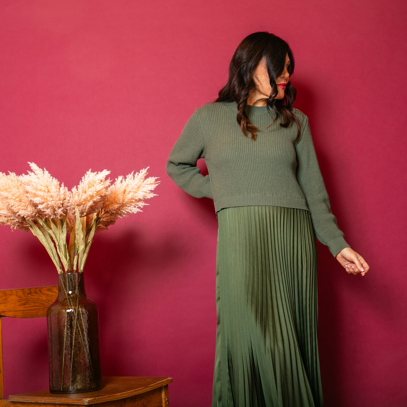 The khaki green Knit And Satin Jumper Dress with a pleated maxi skirt for a flattering fit