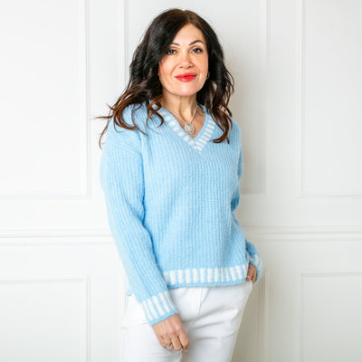 The blue Knitted Prep Sweater with long sleeves and a v neckline 