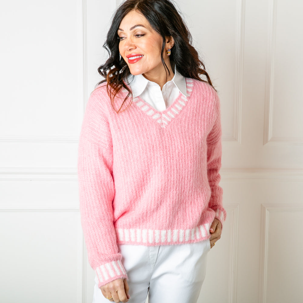 The pink Knitted Prep Sweater with long sleeves and a v neckline 